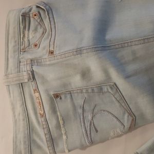 FRANKIE B Faded low rise boot cut jeans. Size 8